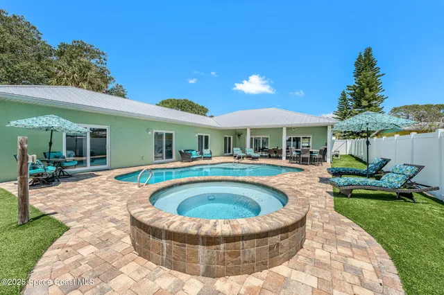 a view of swimming pool and outdoor seating