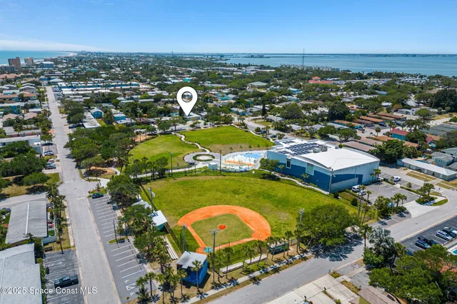 an aerial view of residential houses with outdoor space