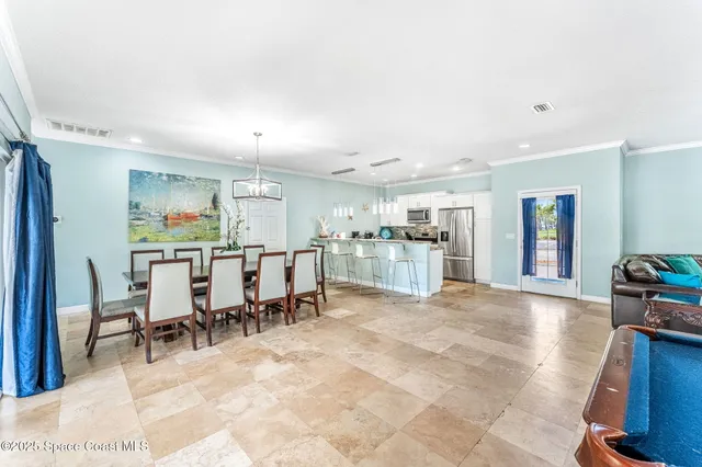 a view of kitchen with furniture and windows