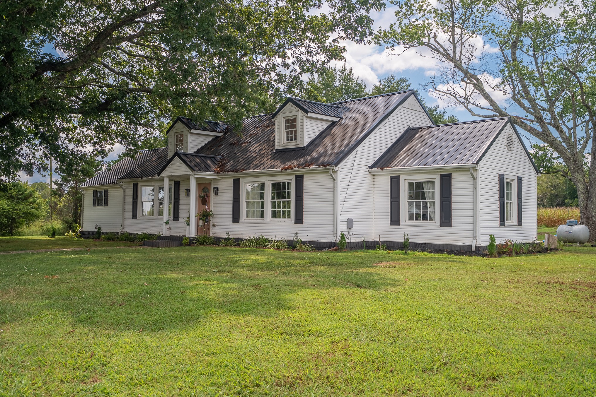 231 Rabbit Trail Road Leoma, TN 38468 - Photo 2 of 37 a front view of a house with a garden