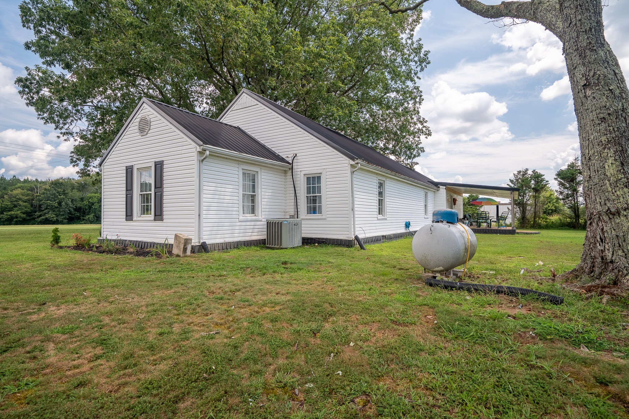 231 Rabbit Trail Road Leoma, TN 38468 - Photo 4 of 37 a view of a house with backyard and garden