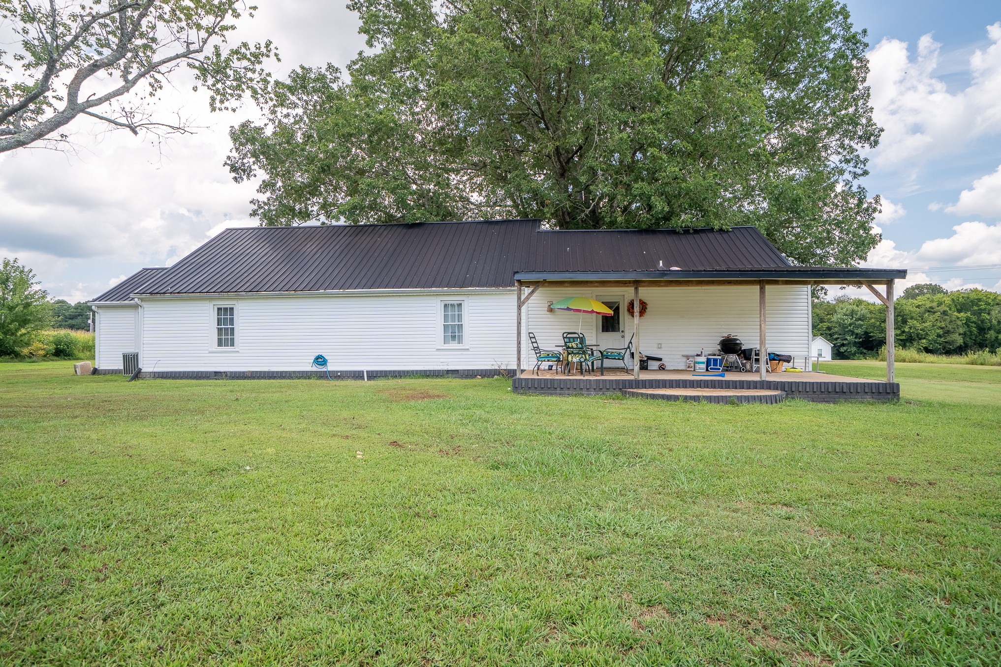 231 Rabbit Trail Road Leoma, TN 38468 - Photo 5 of 37 a front view of house with yard and outdoor seating