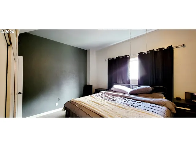 a bedroom with a bed and a closet