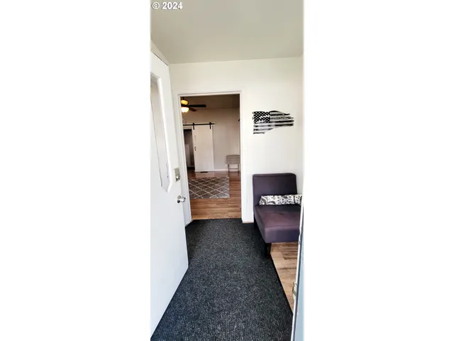 a view of a hallway with a white walls