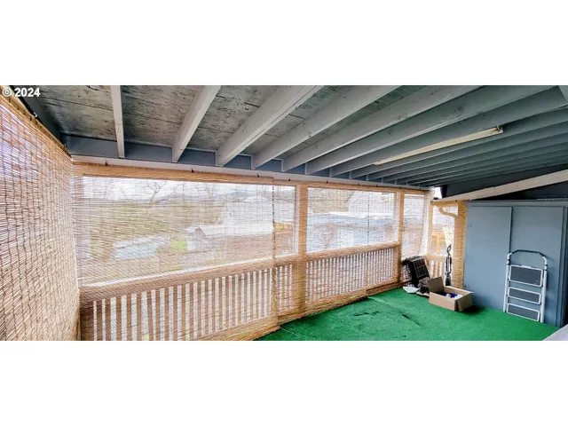 an aerial view of a house with roof deck outdoor space