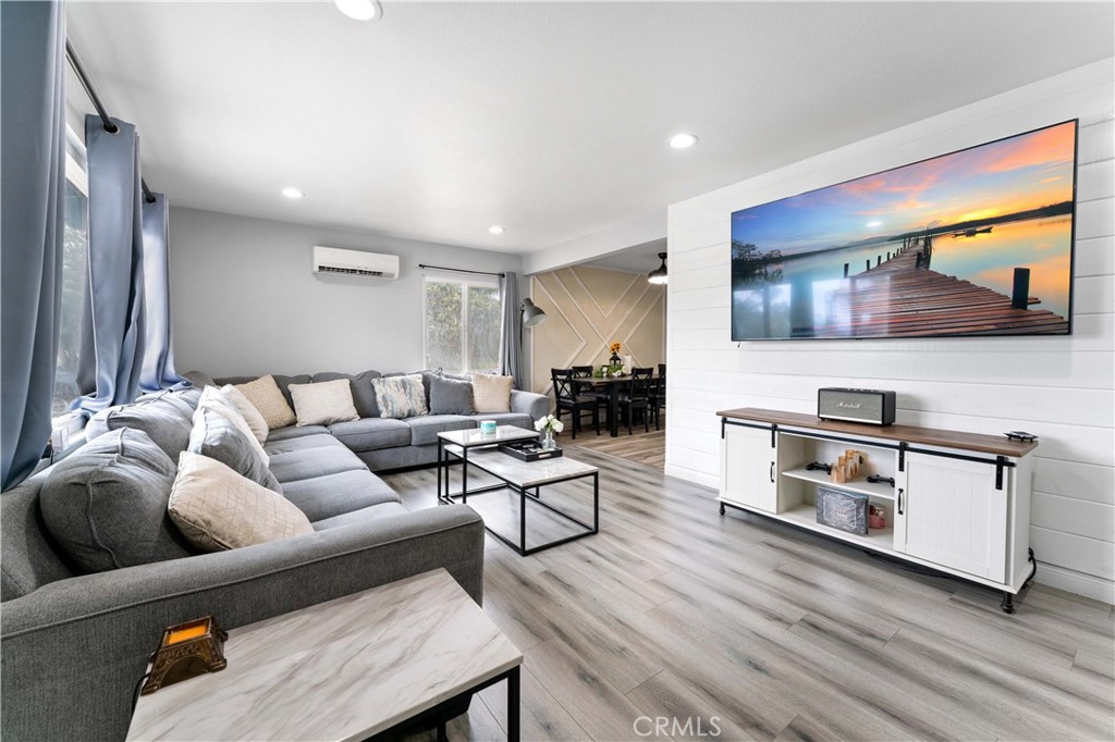 6673 Lessie Lane Riverside, CA 92503 - Photo 1 of 1 a living room with furniture and a flat screen tv