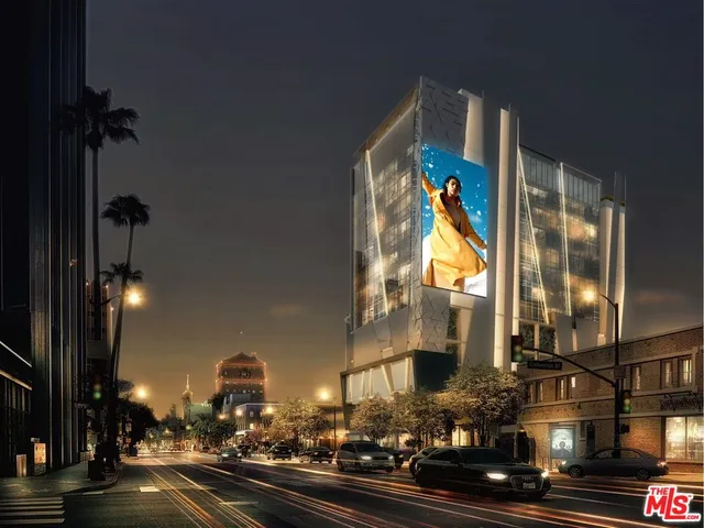 a view of a street with cars on the road