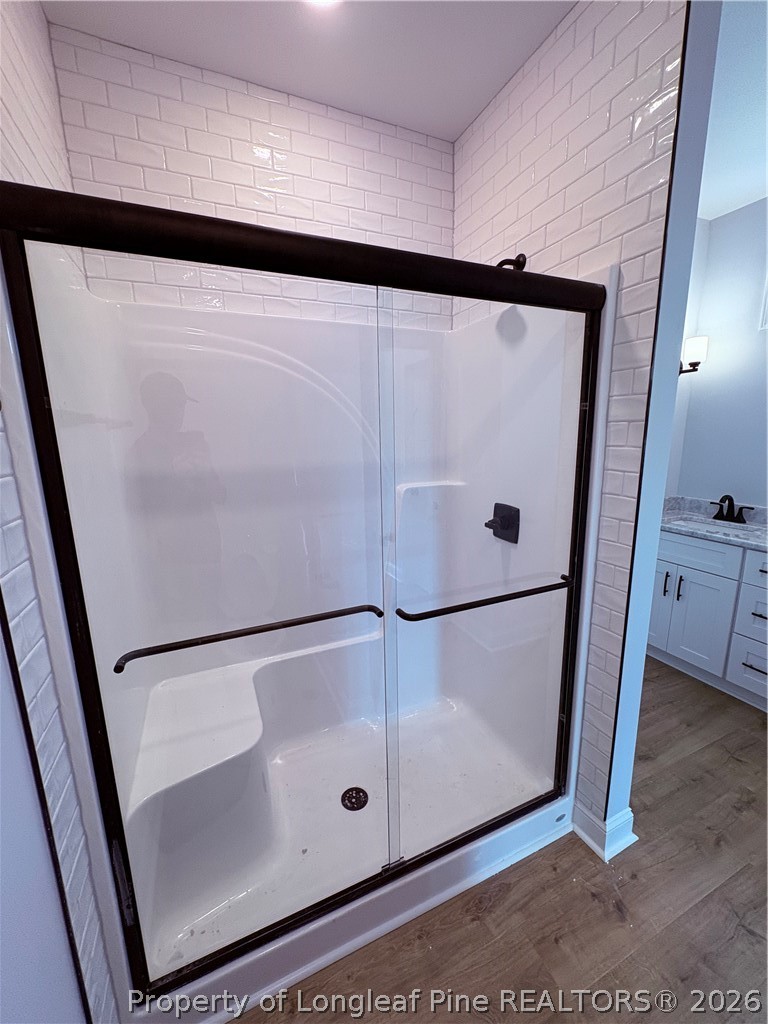 1075 Purdie-Hall Road Tar Heel, NC 28392 - Photo 9 of 28 a bathroom with a glass shower door