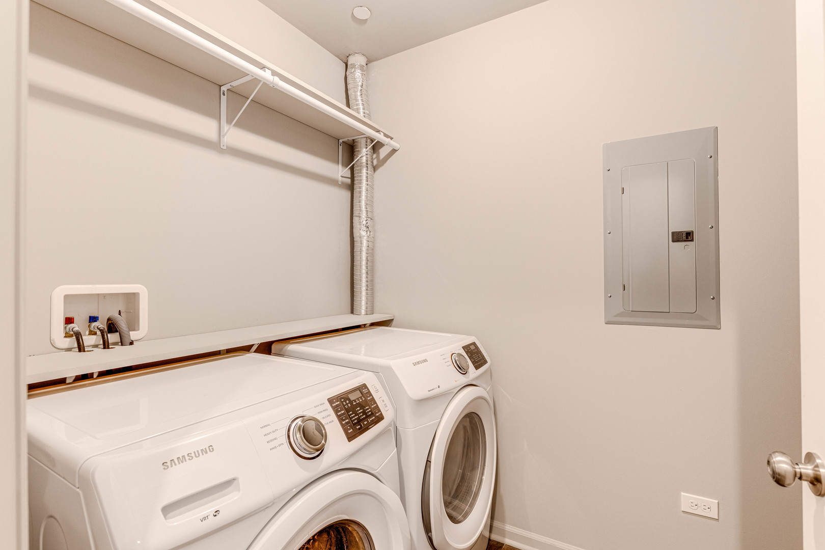 115 Lake Street, Unit 313 Libertyville, IL 60048 - Photo 10 of 10 a utility room with dryer and washer