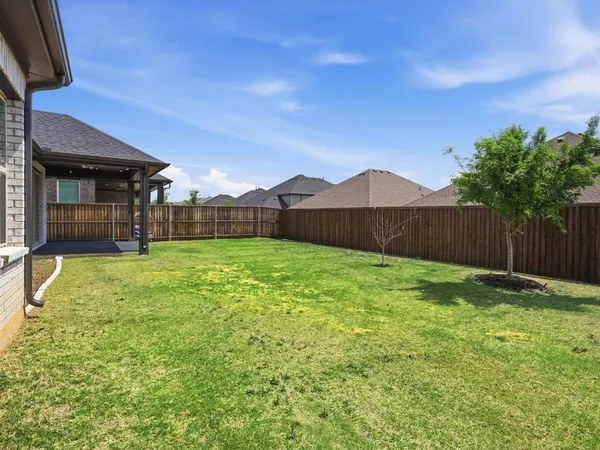 a backyard of a house with lots of green space
