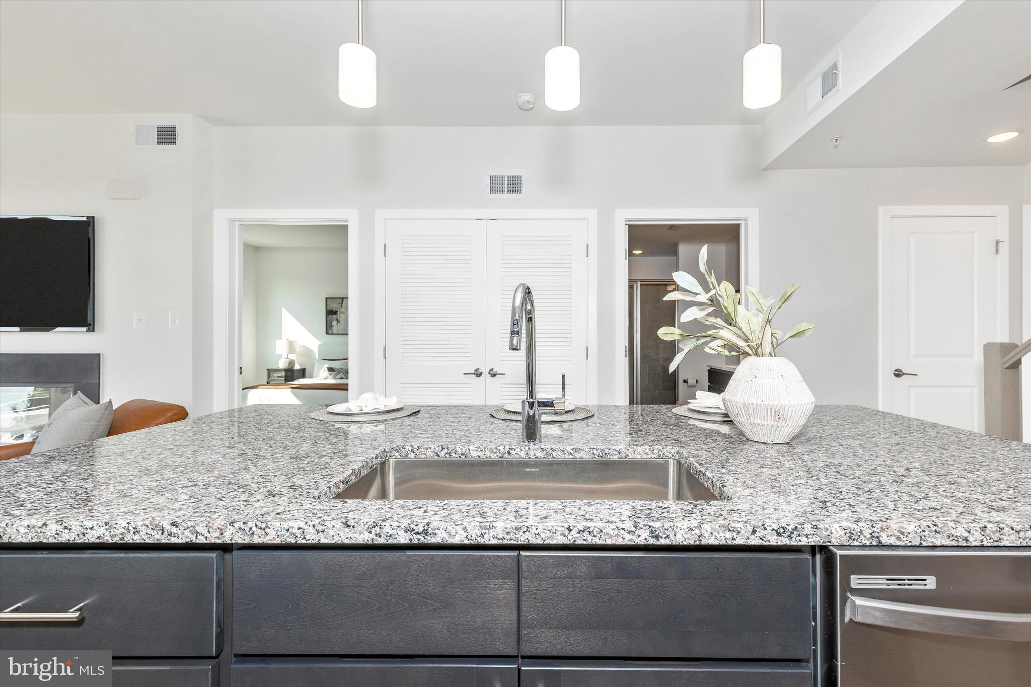 714 Iron Frg Road Frederick, MD 21702 - Photo 14 of 36 a bathroom with a granite countertop sink and a mirror