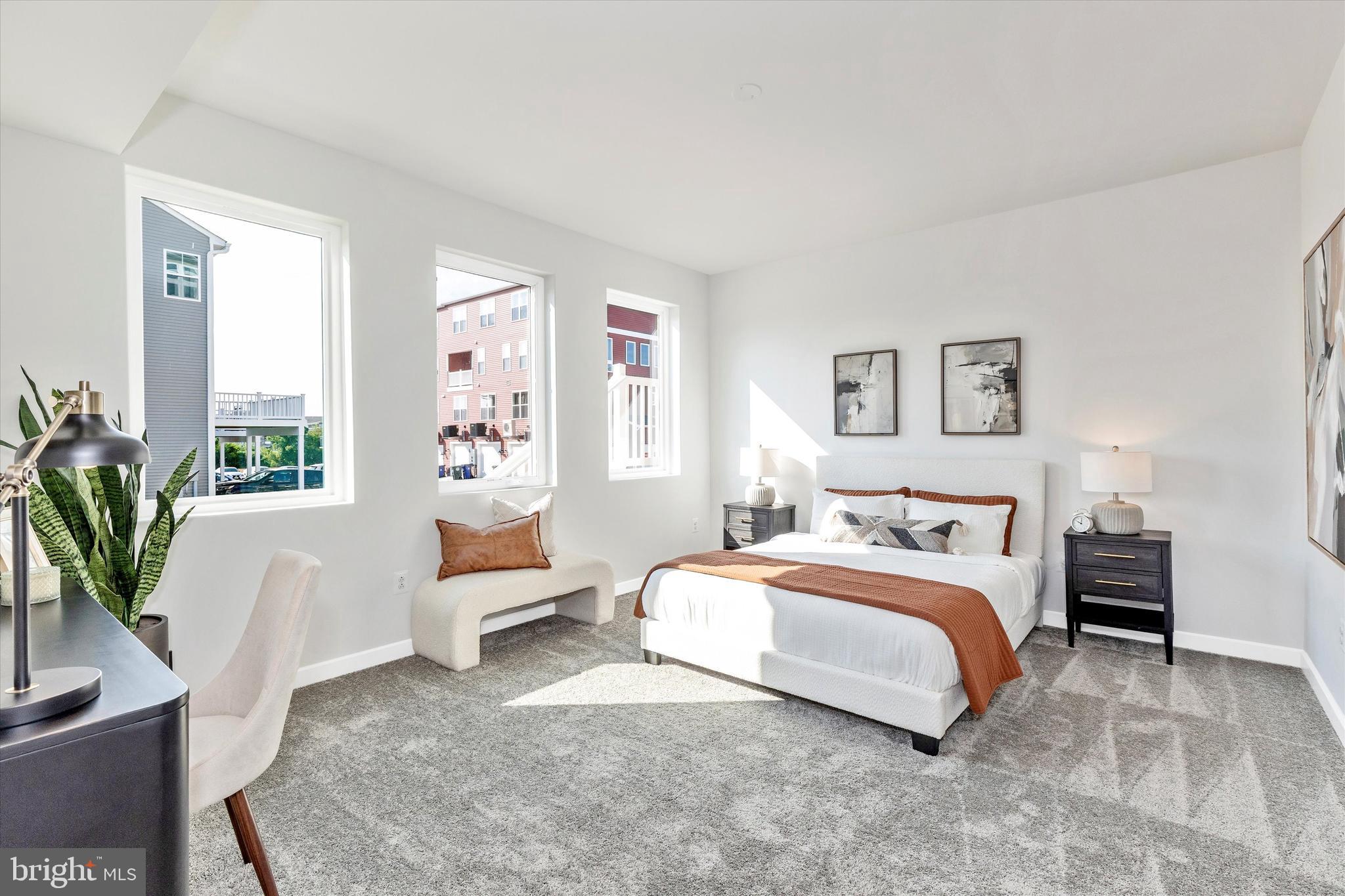 714 Iron Frg Road Frederick, MD 21702 - Photo 19 of 36 a bedroom with a large bed and a potted plant