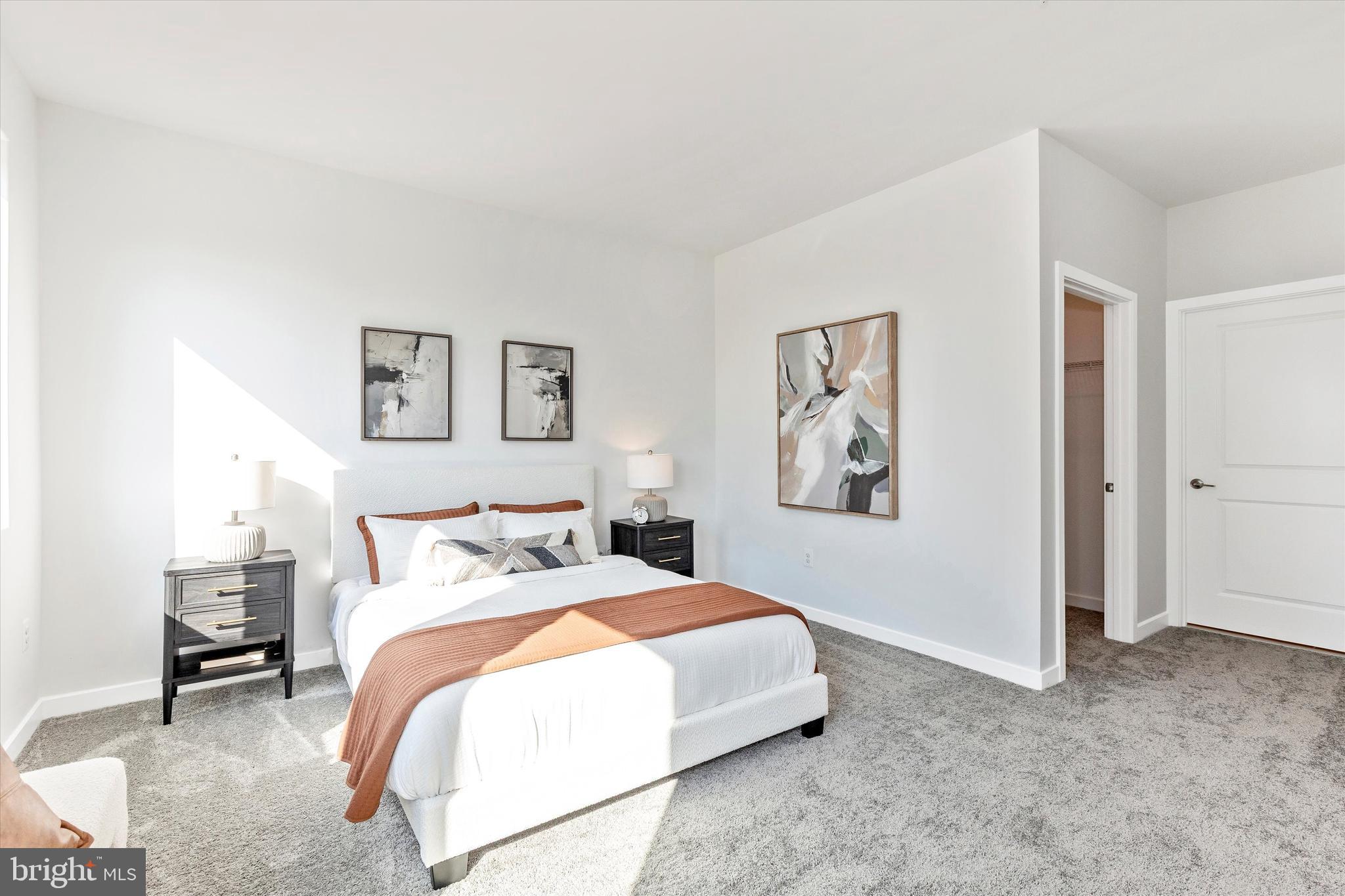 714 Iron Frg Road Frederick, MD 21702 - Photo 21 of 36 a bedroom with bed and painting on the wall