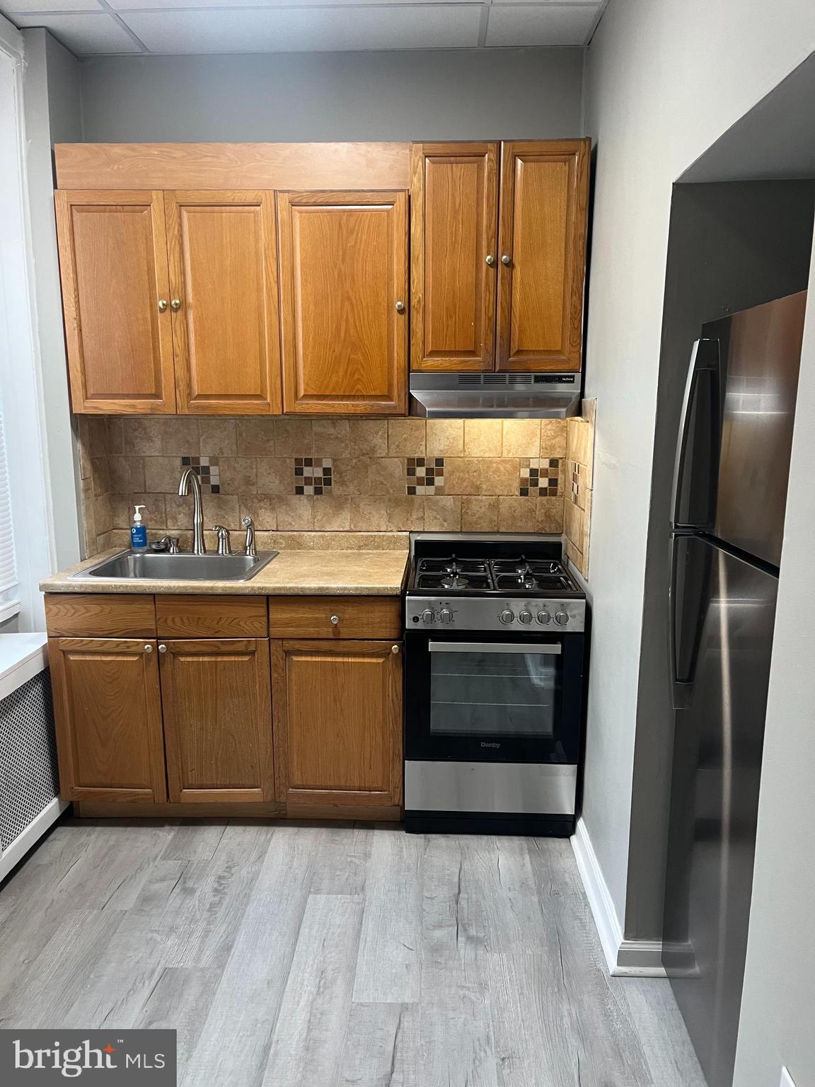 2666 Bridge Street Philadelphia, PA 19137 - Photo 11 of 25 a kitchen with a refrigerator stove and sink