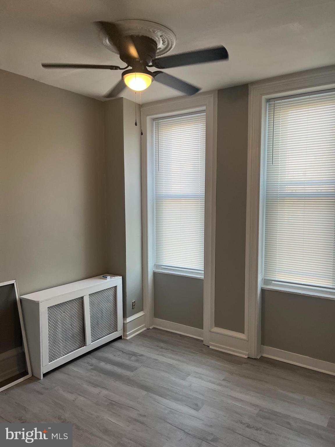 2666 Bridge Street Philadelphia, PA 19137 - Photo 15 of 25 an empty room with wooden floor fan and windows