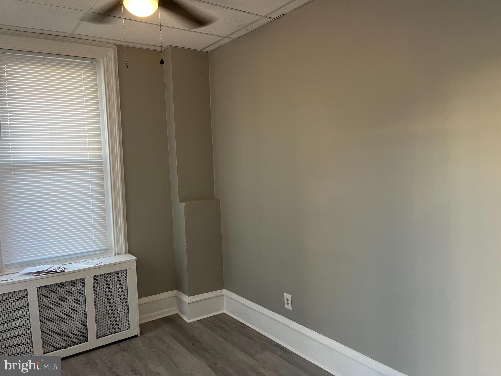 2666 Bridge Street Philadelphia, PA 19137 - Photo 19 of 25 a view of an empty room with wooden floor and a window