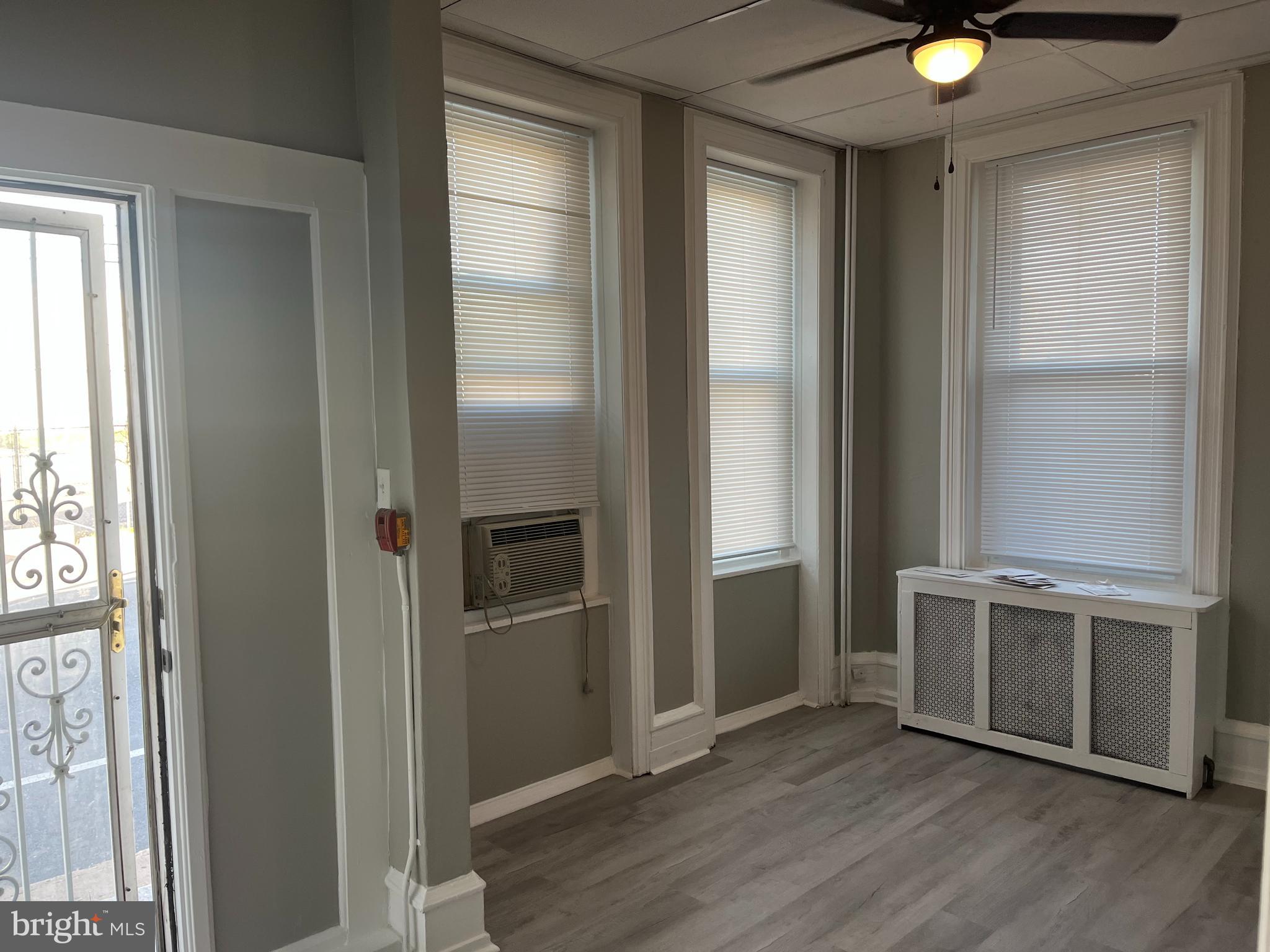 2666 Bridge Street Philadelphia, PA 19137 - Photo 4 of 25 an empty room with wooden floor and windows