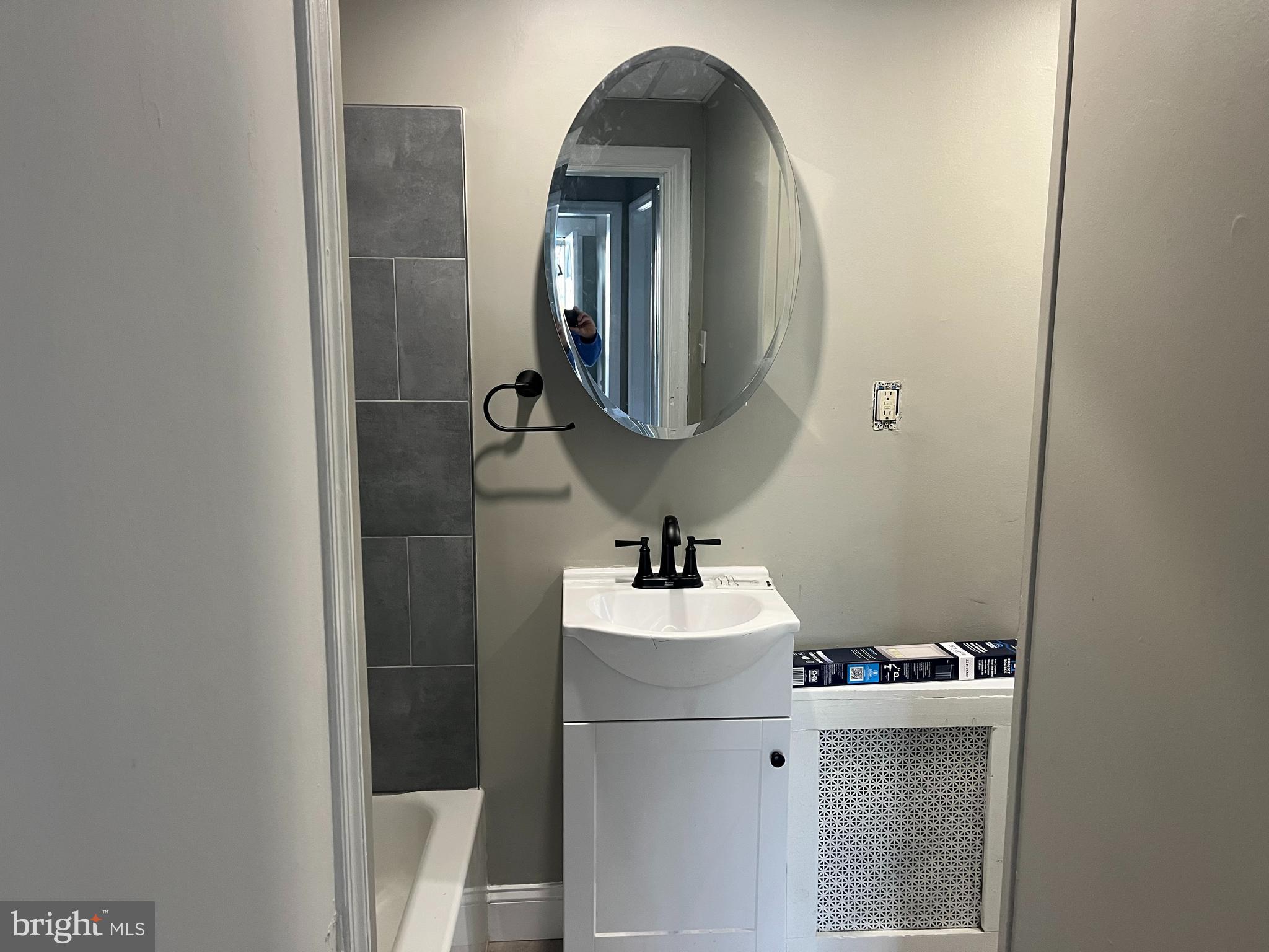 2666 Bridge Street Philadelphia, PA 19137 - Photo 8 of 25 a bathroom with a sink vanity and mirror