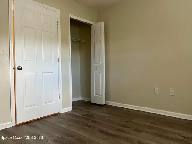 a bathroom with a double vanity sink mirror and toilet