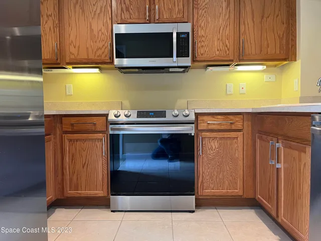 a kitchen with a stove and a microwave