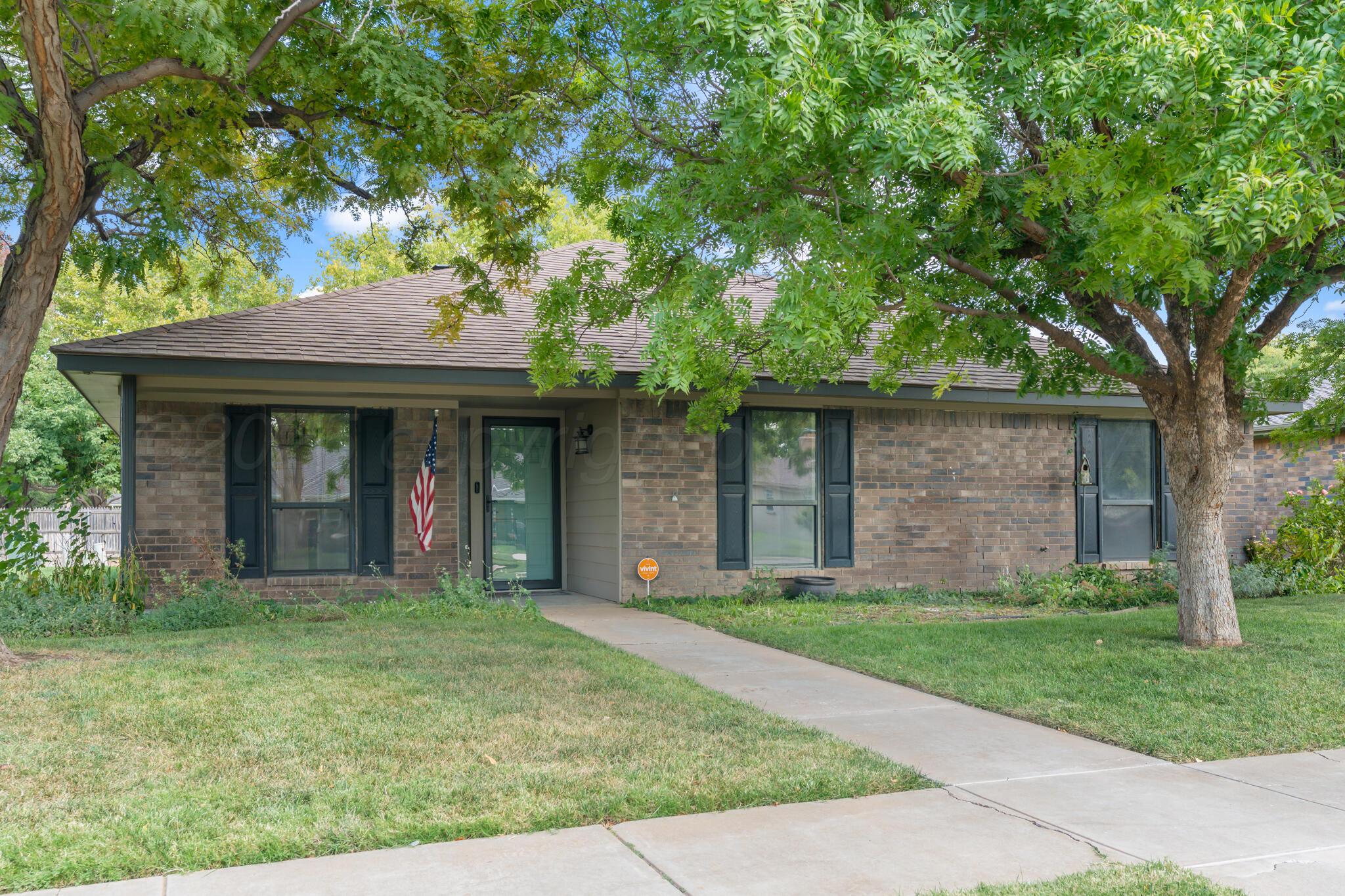 3513 Timber Drive Amarillo, TX 79121 - Photo 1 of 23 front view of a brick house with a yard