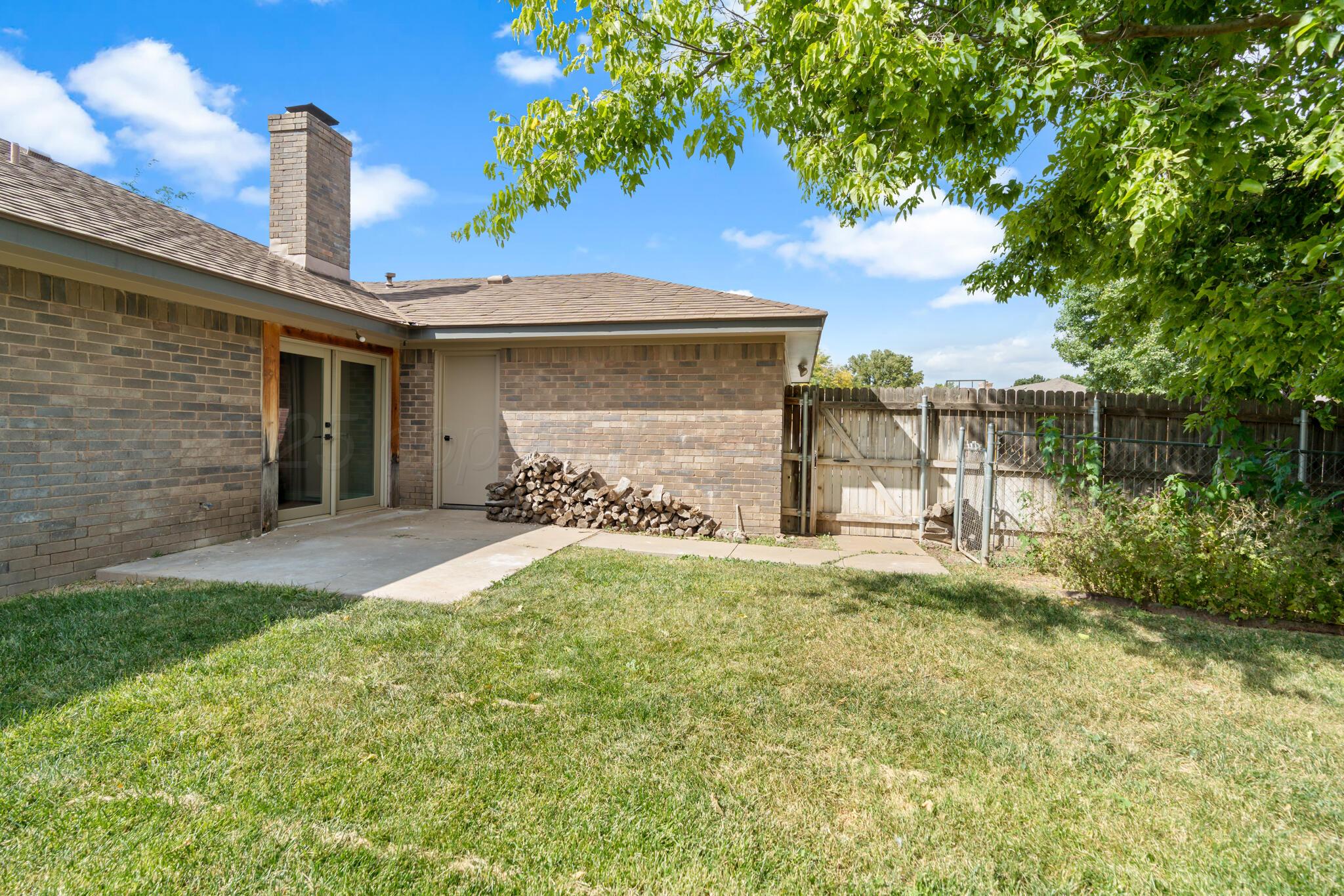 3513 Timber Drive Amarillo, TX 79121 - Photo 22 of 23 a front view of a house with garden