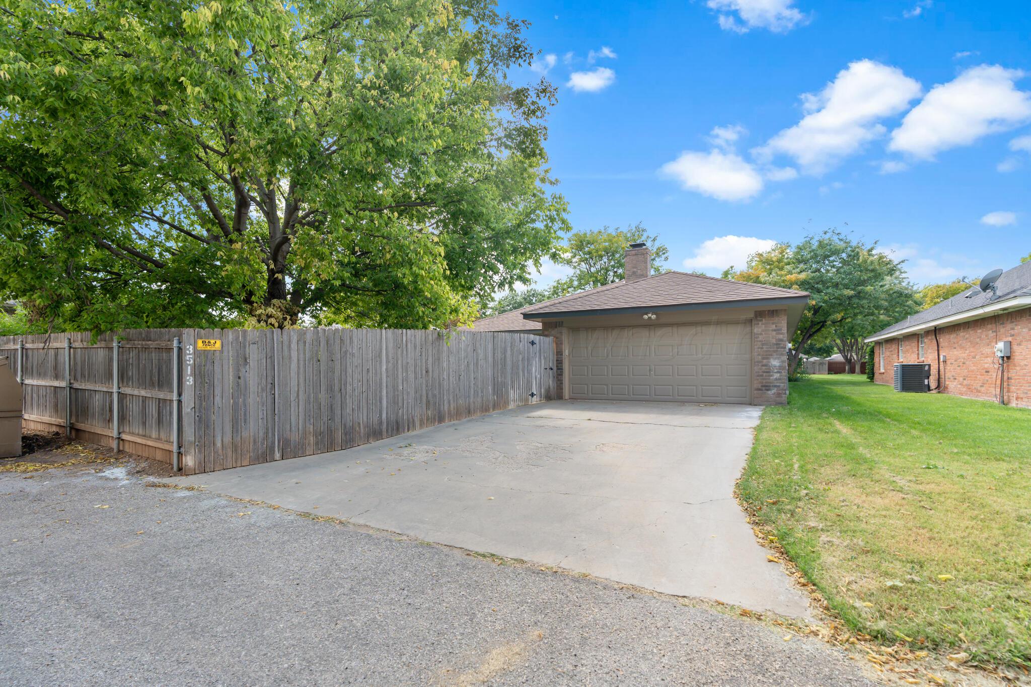 3513 Timber Drive Amarillo, TX 79121 - Photo 23 of 23 a view of backyard space and garage