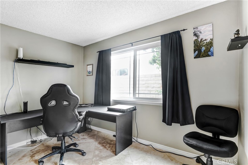 3265 Sheri Drive Simi Valley, CA 93063 - Photo 9 of 25 a view of a workspace with furniture and a window