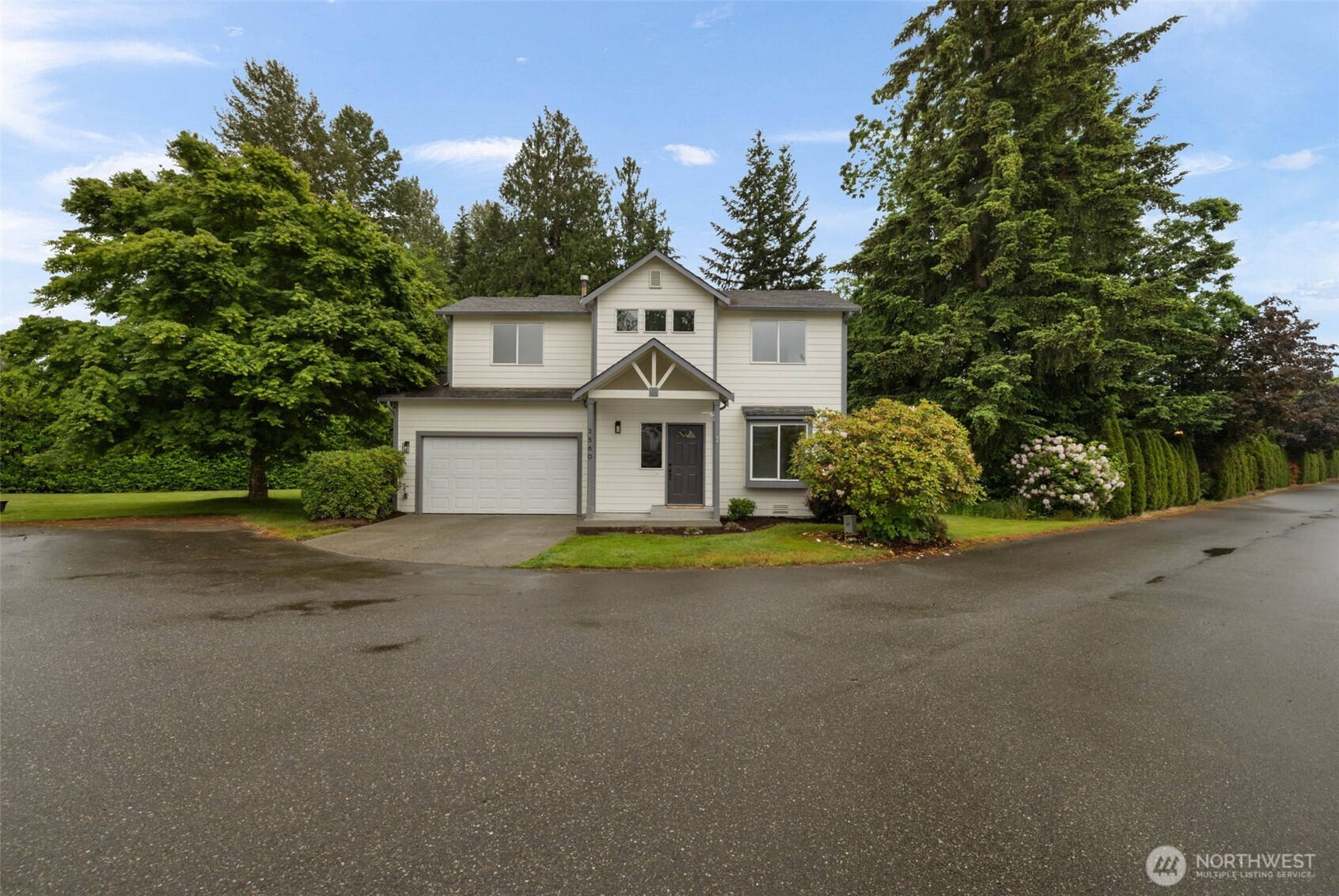 3560 Courtyard Lane Bremerton, WA 98310 - Photo 26 of 26 a front view of a house with a yard and garage