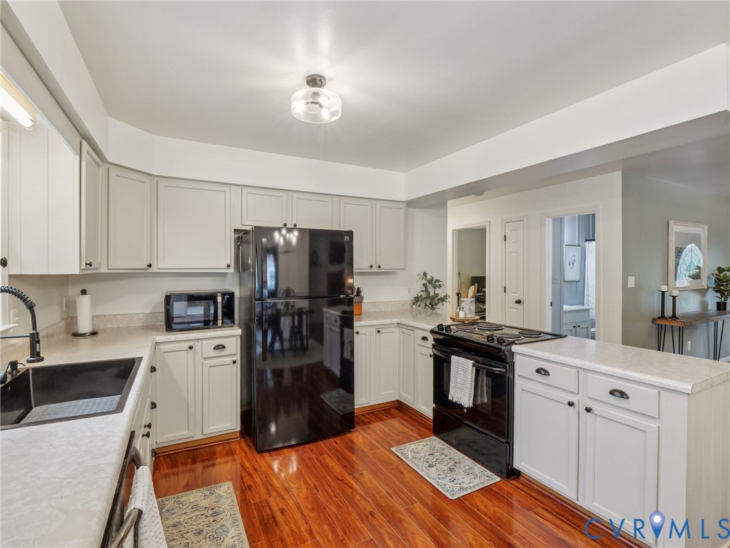 2568 Crewsville Road Bumpass, VA 23024 - Photo 14 of 30 a kitchen with a sink appliances and cabinets