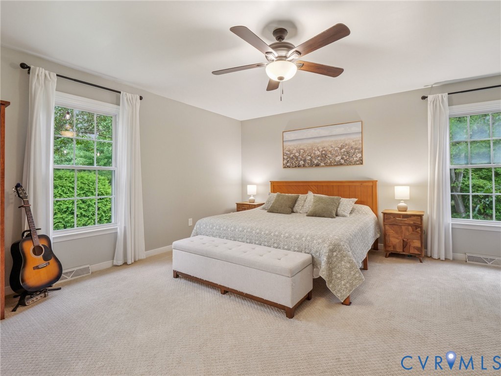 2568 Crewsville Road Bumpass, VA 23024 - Photo 16 of 30 a spacious bedroom with a bed and a large window