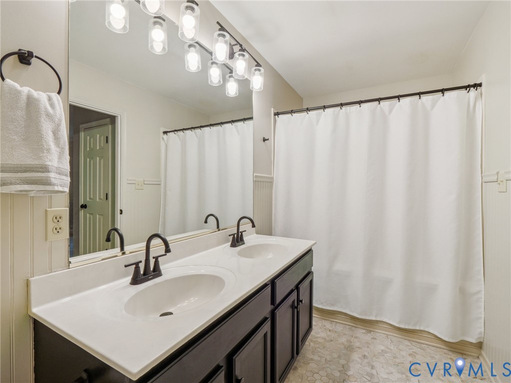 2568 Crewsville Road Bumpass, VA 23024 - Photo 20 of 30 a bathroom with a sink and a mirror