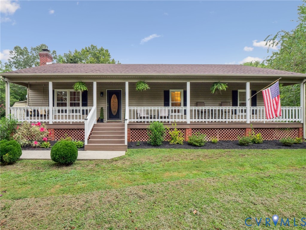 2568 Crewsville Road Bumpass, VA 23024 - Photo 2 of 30 a front view of a house with a garden