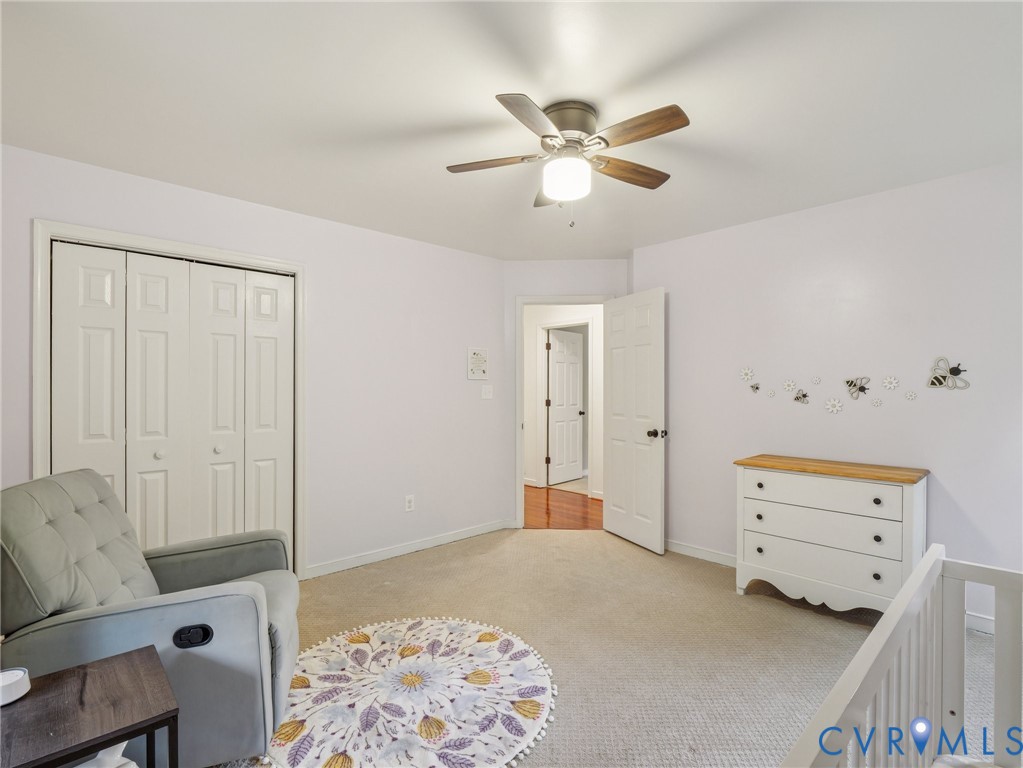 2568 Crewsville Road Bumpass, VA 23024 - Photo 22 of 30 a bedroom with a bed and a chandelier