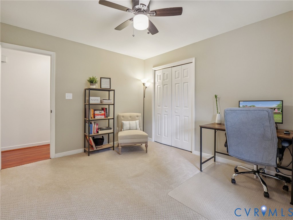 2568 Crewsville Road Bumpass, VA 23024 - Photo 25 of 30 a view of a workspace with furniture and a ceiling fan