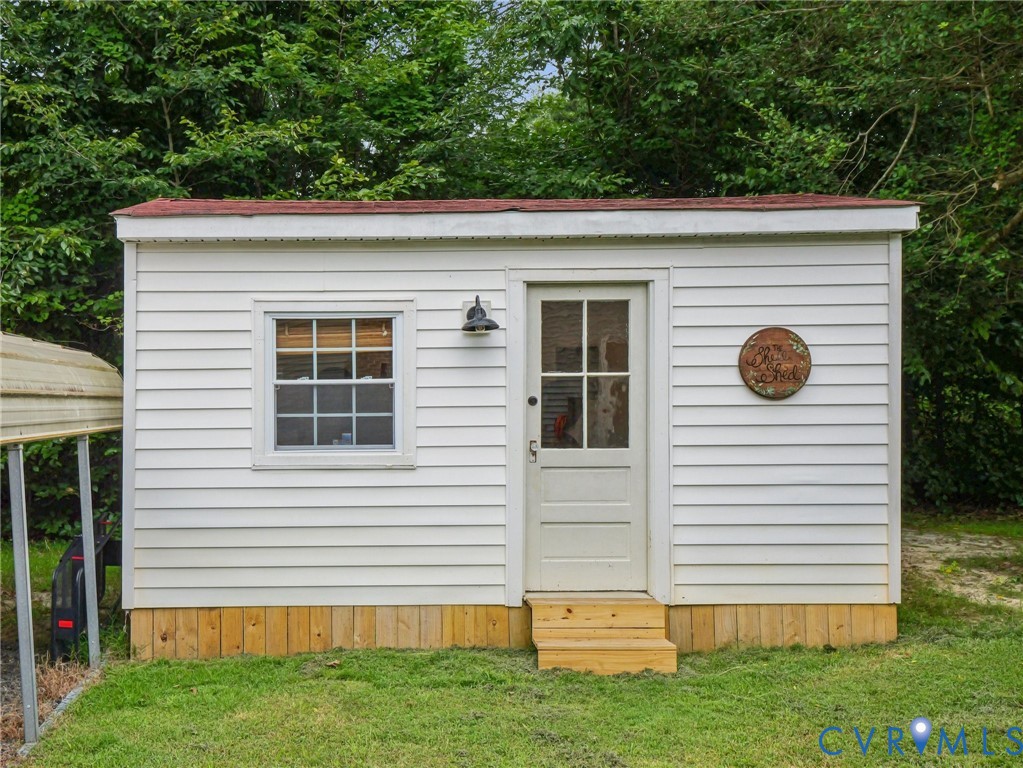 2568 Crewsville Road Bumpass, VA 23024 - Photo 27 of 30 a view of a house with a yard