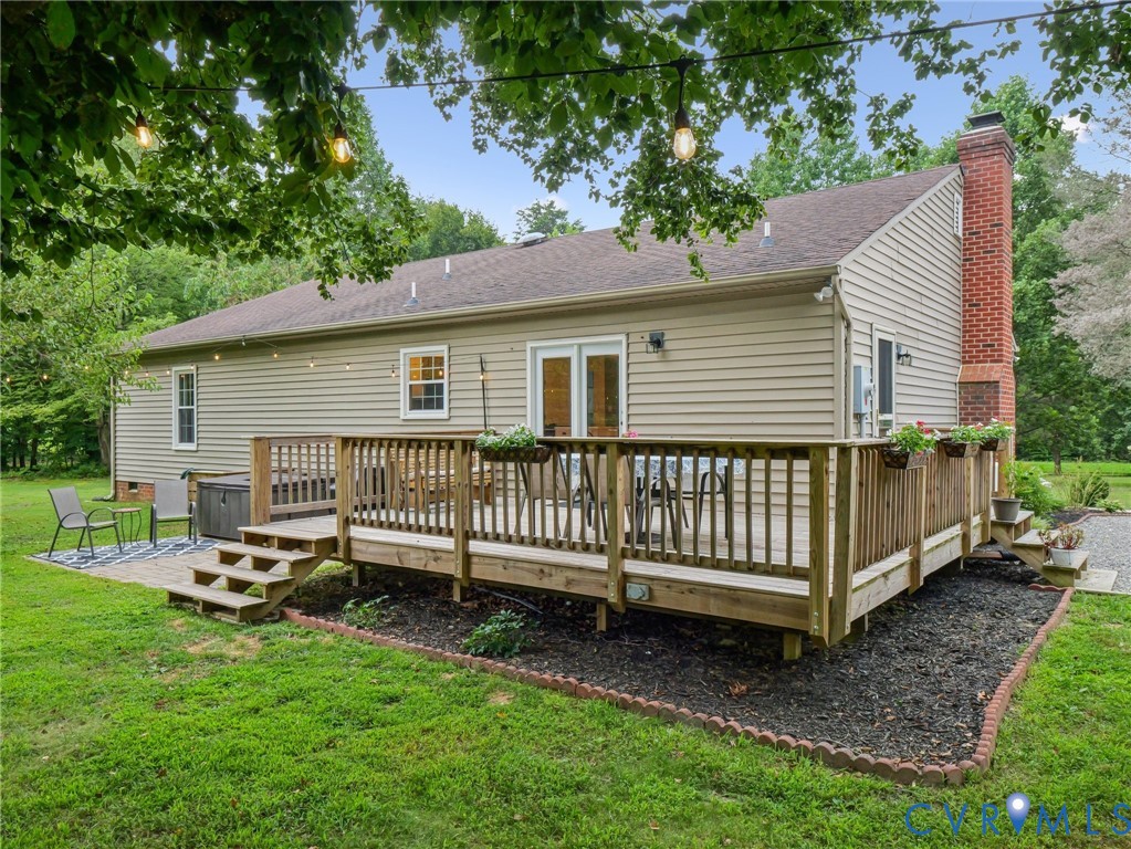 2568 Crewsville Road Bumpass, VA 23024 - Photo 30 of 30 a view of a house with a yard and deck