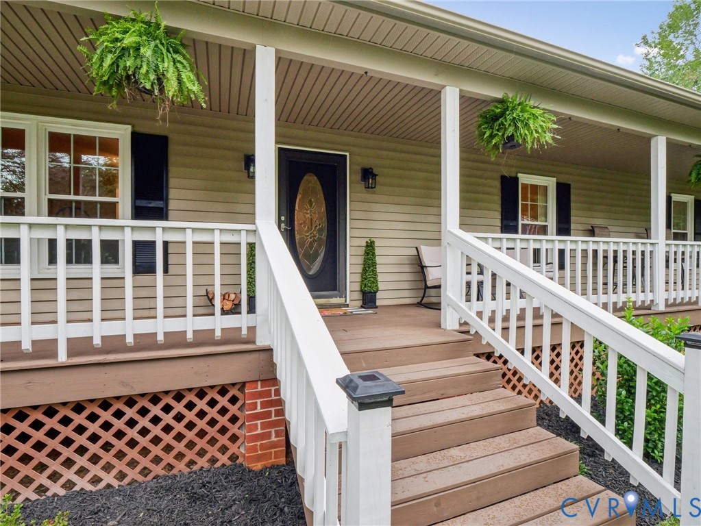 2568 Crewsville Road Bumpass, VA 23024 - Photo 3 of 30 a view of a balcony with wooden floor and fence