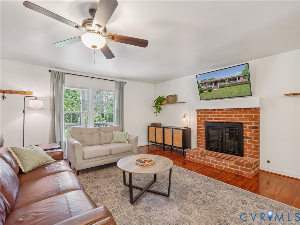 2568 Crewsville Road Bumpass, VA 23024 - Photo 6 of 30 a living room with furniture a window and a fireplace