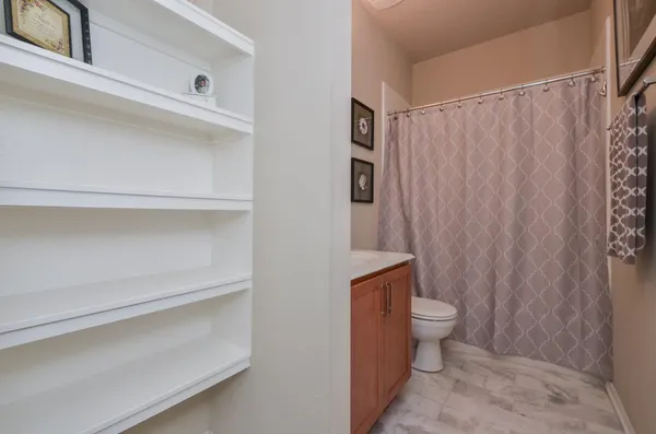 a bathroom with a toilet and shower
