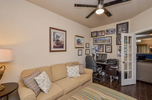 a living room with furniture a rug and a window