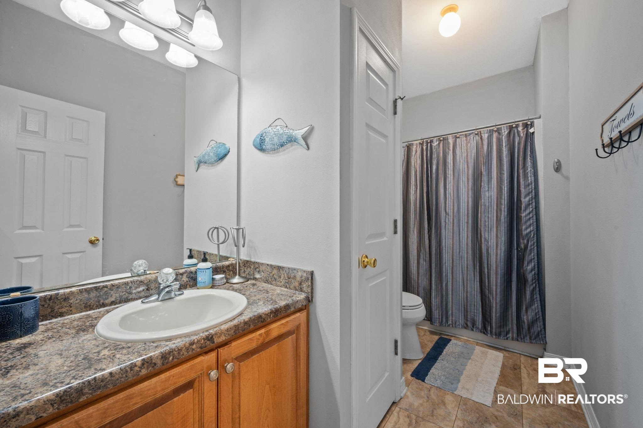 9539 Lakeview Road Bay Minette, AL 36507 - Photo 24 of 45 Bathroom with a shower with curtain, vanity, and toilet