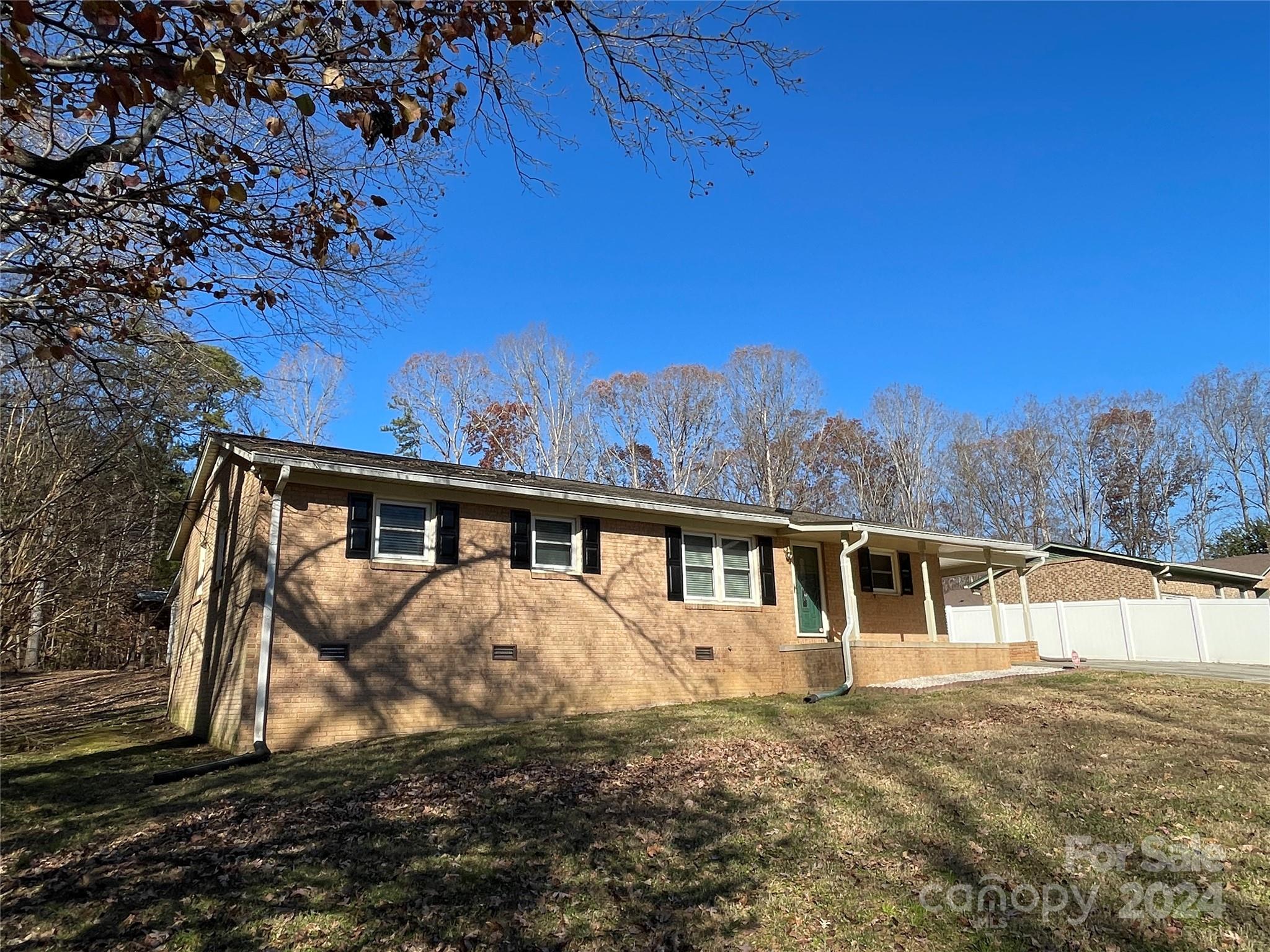 228 Shadowbrook Road Stanley, NC 28164 - Photo 2 of 44 a view of a house with a yard