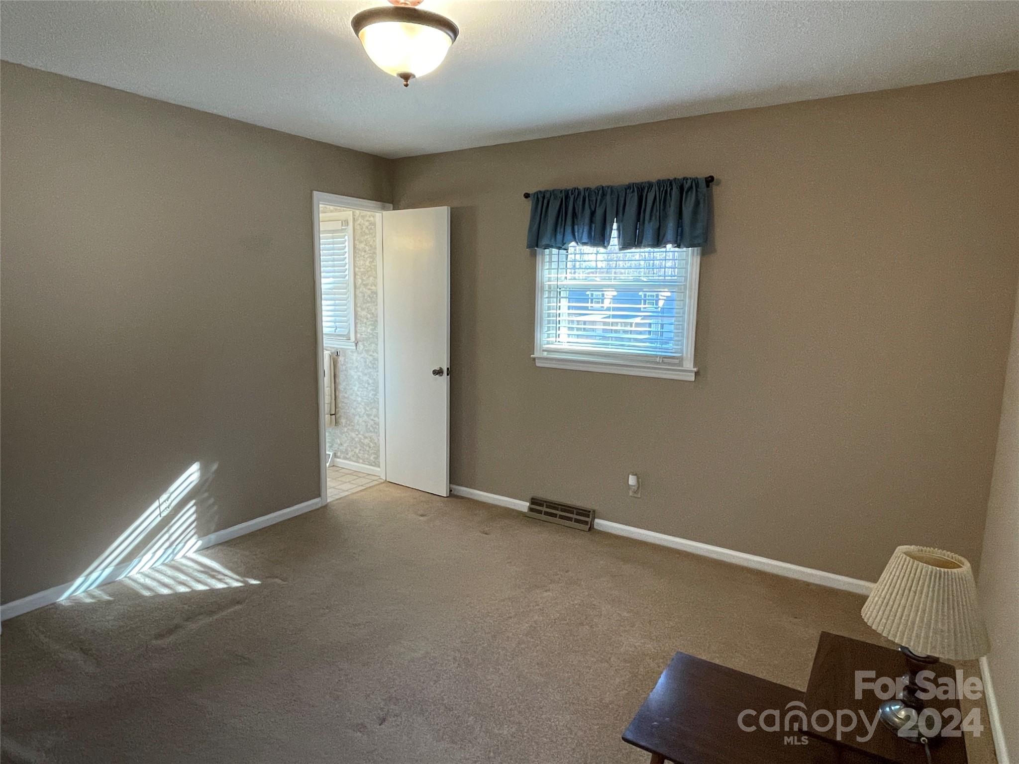228 Shadowbrook Road Stanley, NC 28164 - Photo 25 of 44 a view of an empty room with a window