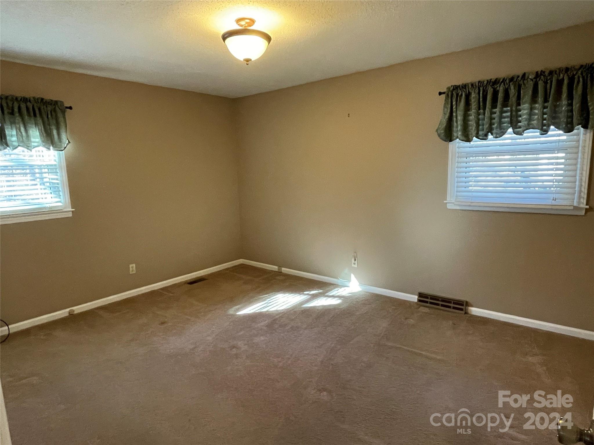 228 Shadowbrook Road Stanley, NC 28164 - Photo 28 of 44 an empty room with a window