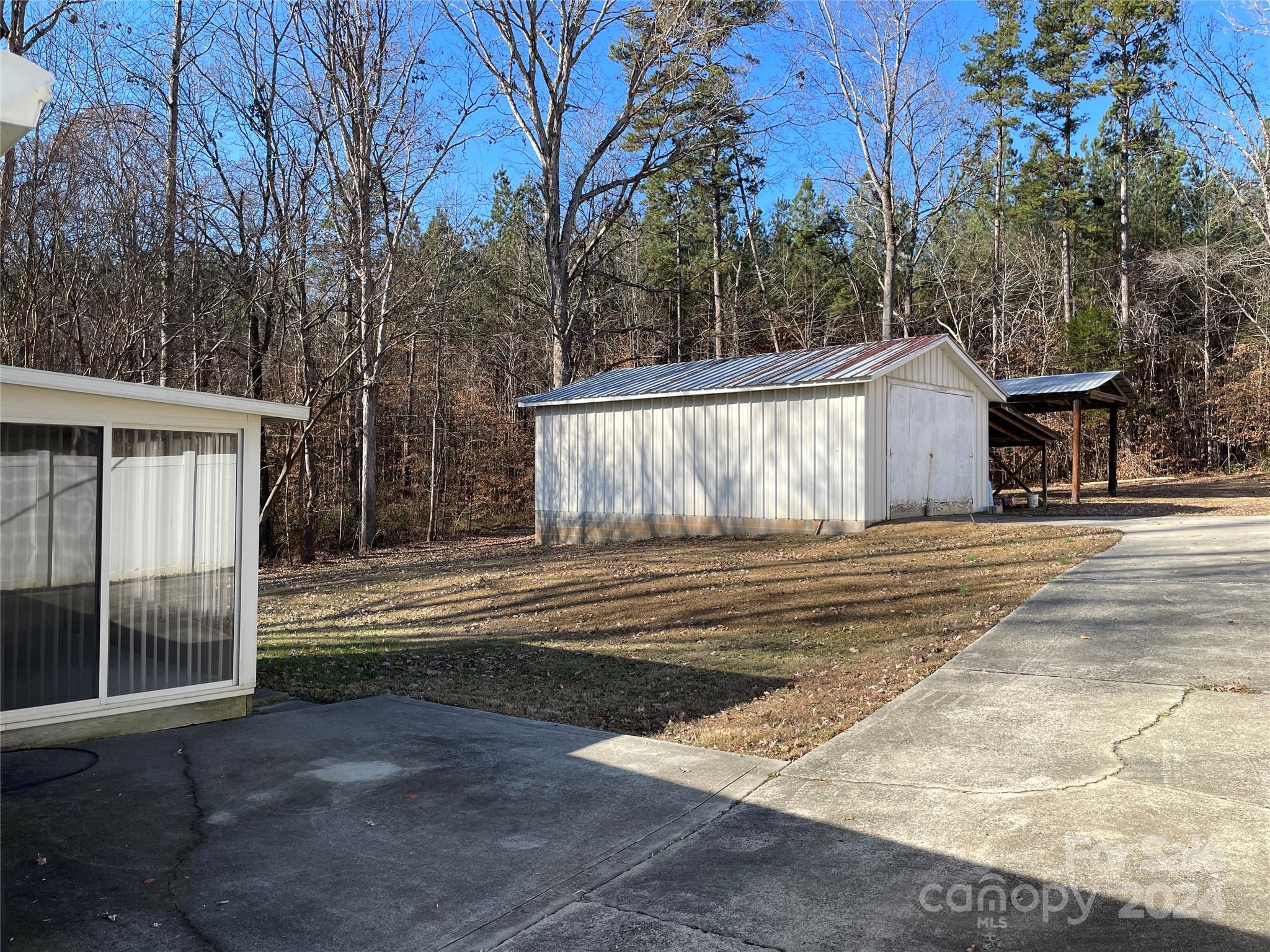 228 Shadowbrook Road Stanley, NC 28164 - Photo 37 of 44 a view of a house with a yard