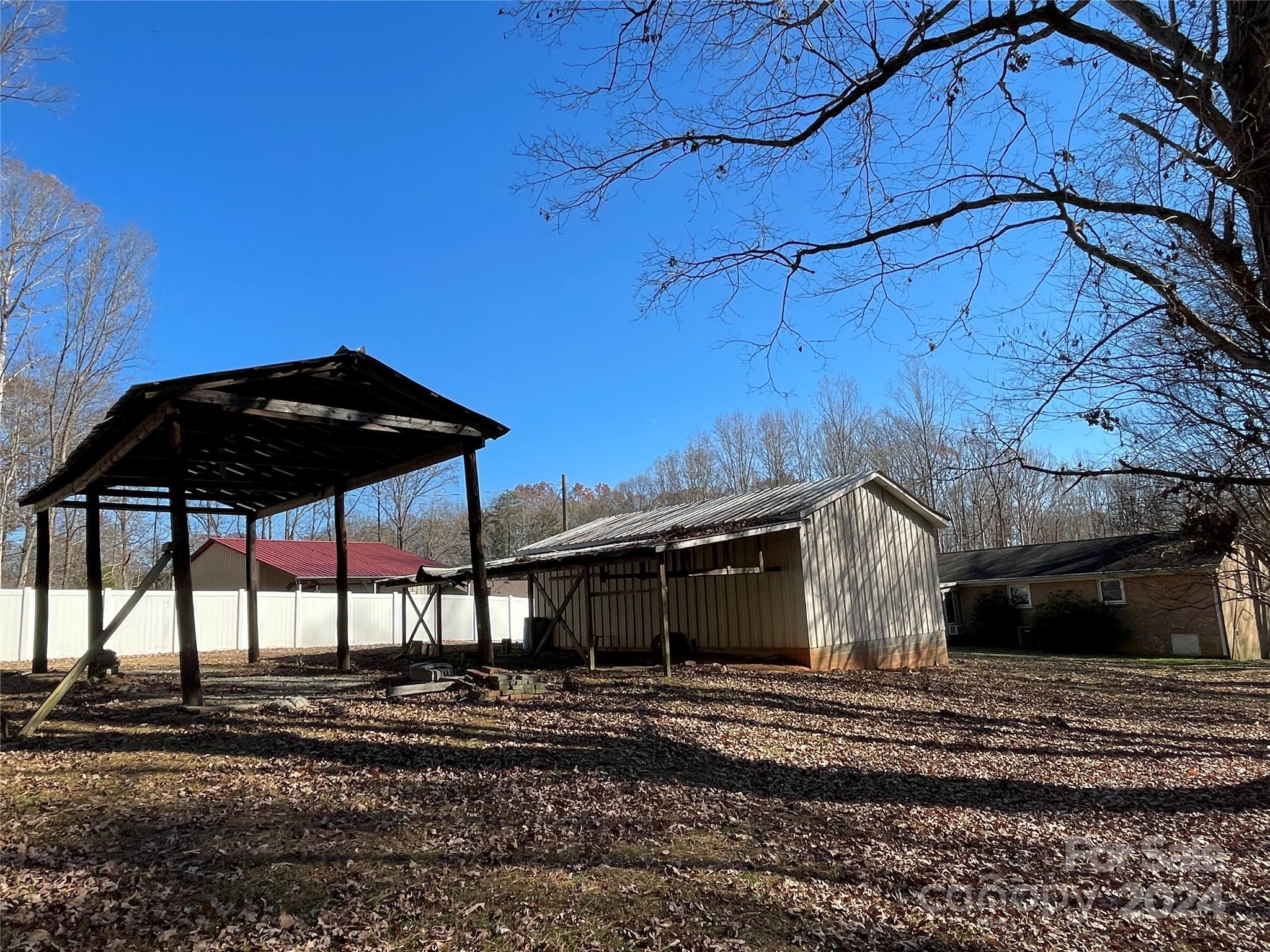 228 Shadowbrook Road Stanley, NC 28164 - Photo 39 of 44 a view of a house with a yard