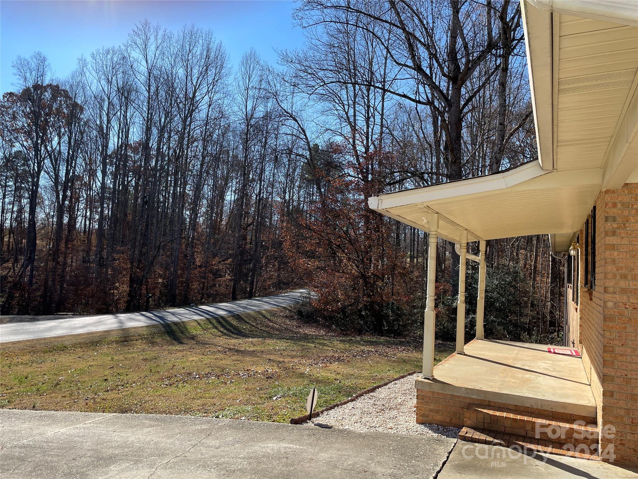 228 Shadowbrook Road Stanley, NC 28164 - Photo 4 of 44 a view of a patio with a table and chairs