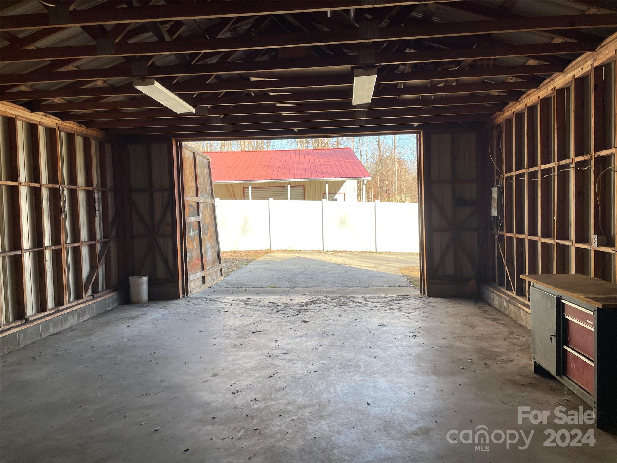 228 Shadowbrook Road Stanley, NC 28164 - Photo 41 of 44 a view of empty room with wooden floor and windows