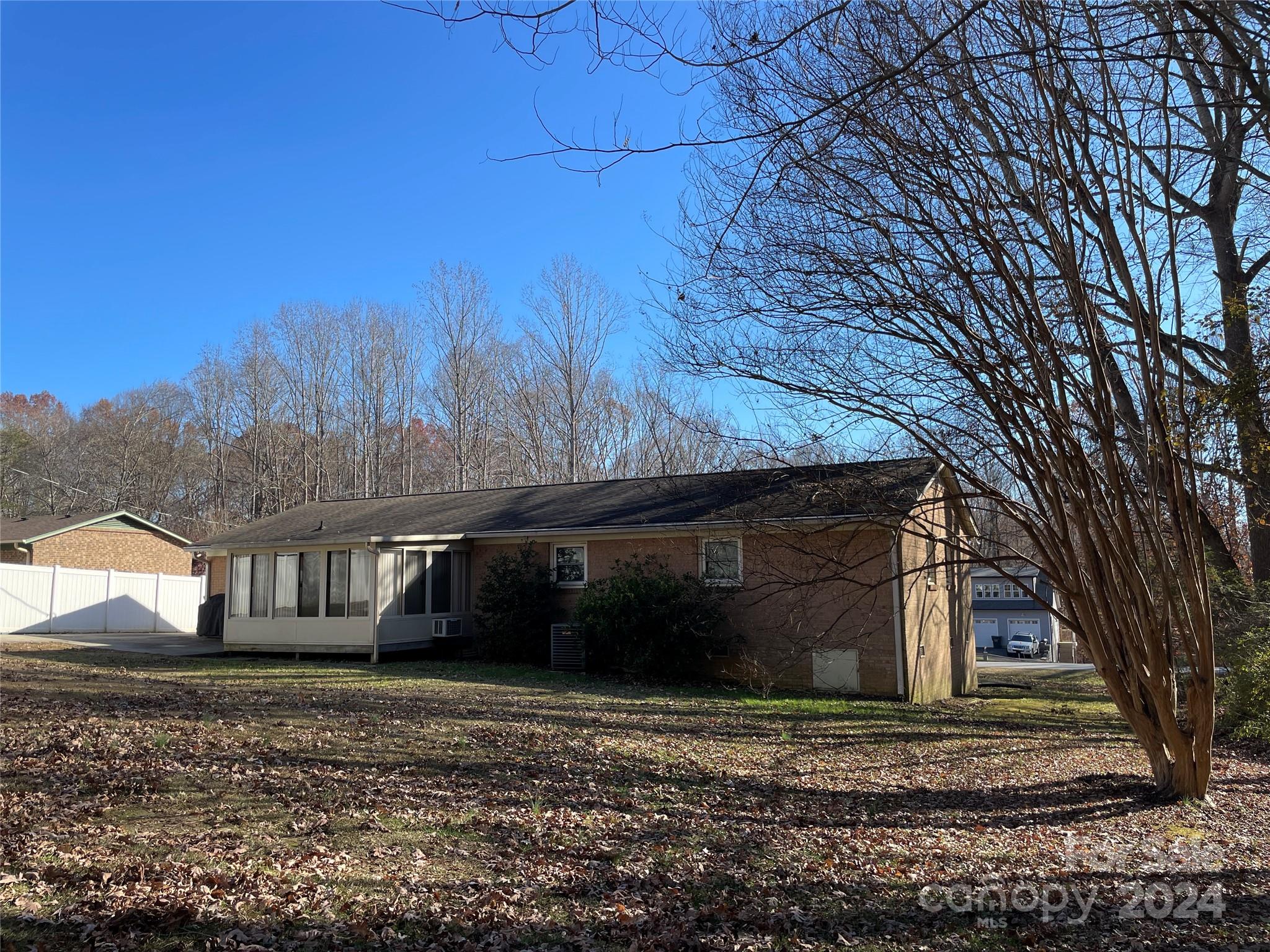 228 Shadowbrook Road Stanley, NC 28164 - Photo 6 of 44 a front view of a house with a yard